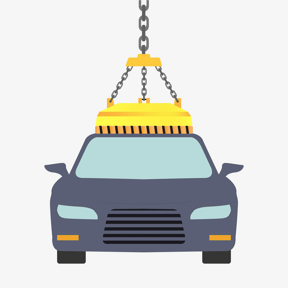 Car battery with green recycle sign.